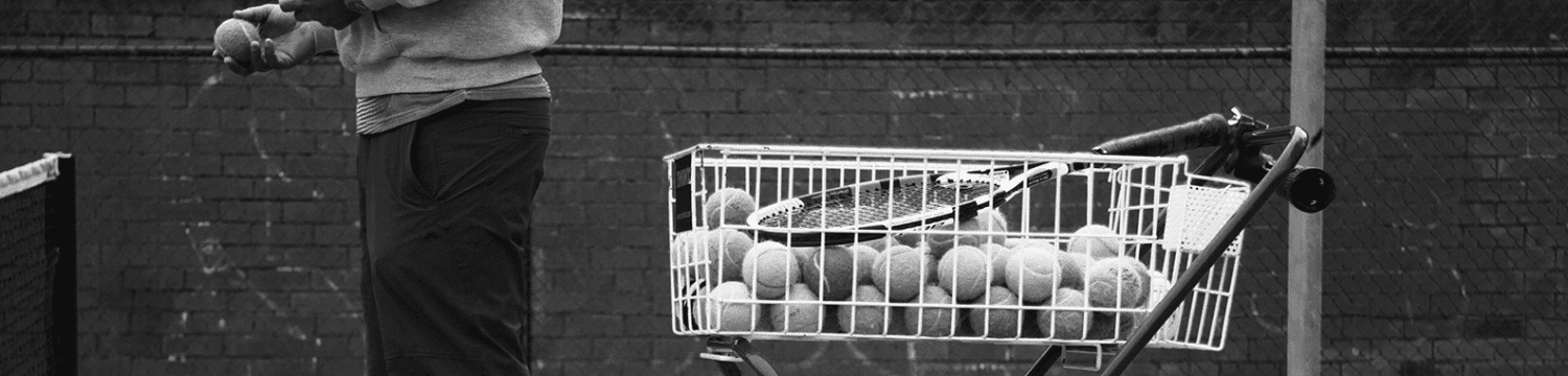 Photo of coaching basket full of tennis balls